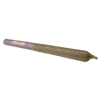 Angled close-up of a pre-rolled joint with a purple filter tip labeled "CBG Infused Mango PR 3 x 0.5 g" on a white background