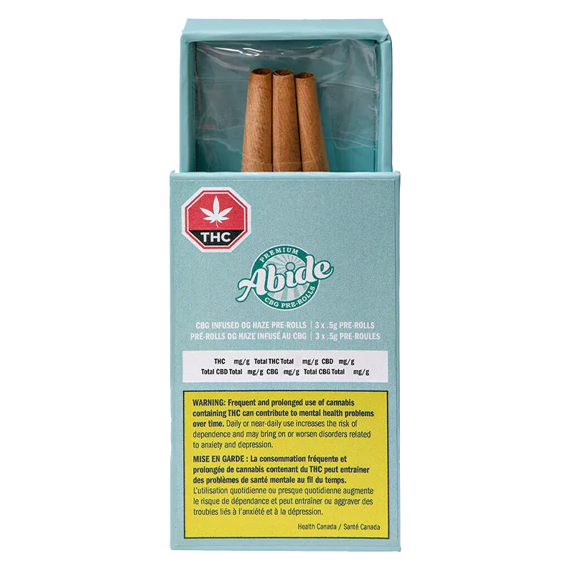 Front view of a teal box labeled "CBG Infused OG Haze PR 3 x 0.5 g" with three brown pre-rolls visible in an open top and a warning label on the front