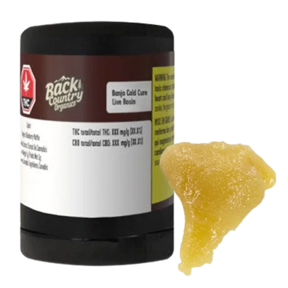 A front three-quarter view of a black tub next to a golden, sticky piece of concentrate labeled "Banjo Cold Cure Live Rosin."