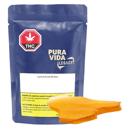Front-facing shot of a blue pouch labeled Pura Vida Legacy with bright orange Venom OG Jumbo Slab Shatter pieces in the foreground.