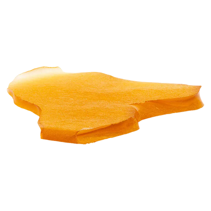 Angled close-up of a rich amber-orange slab of Venom OG Jumbo Slab Shatter showing smooth surface texture and a slightly beveled edge