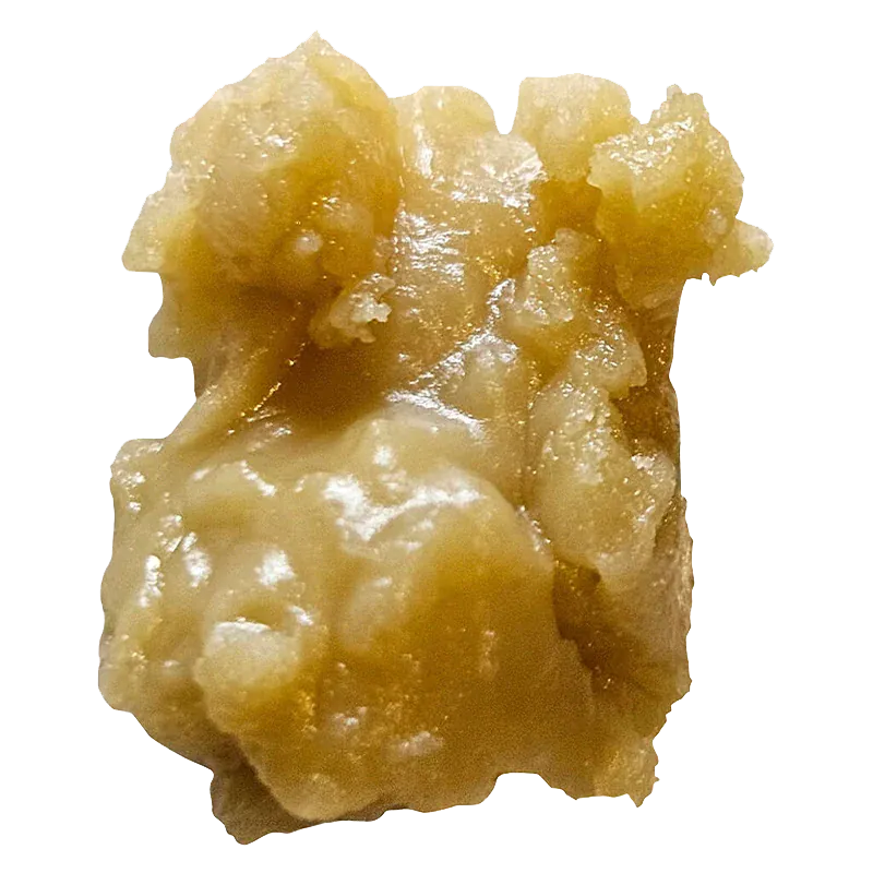 Close-up of a golden, chunky wax nugget of Gilded Live Rosin against a white background.
