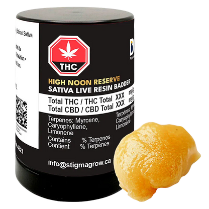 Front-lit photograph of a black jar and a dollop of golden concentrate labeled High Noon Reserve Original Z Live Resin Badder.