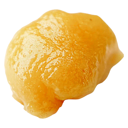 Close-up of a glossy golden globule of live resin badder, High Noon Reserve Original Z Live Resin Badder, shown on a white background.