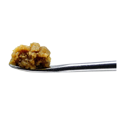Close-up side view of a small golden crumble on a metal dab tool, Barbara Bud Cold Cured Ice Water Hash.