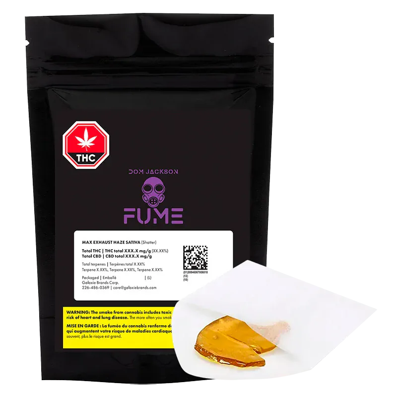Front-facing shot of a black pouch labeled "Max Exhaust Haze Shatter" with purple FUME logo and a piece of amber shatter on white parchment in the foreground