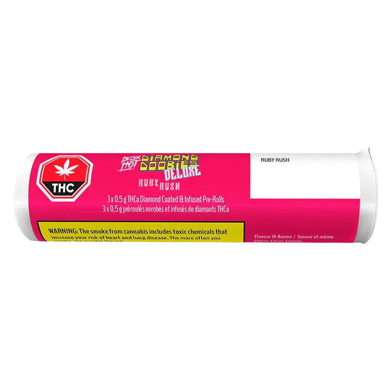 Horizontal front view of a pink-labeled tube reading Diamond Doobies Deluxe Ruby Rush Infused PR 3 x 0.5 g with THC icon and warning panel.