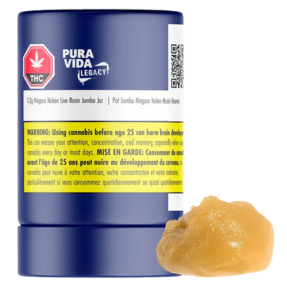 Front-facing view of a blue jar labeled "Niagara Nuken Jumbo Jar Rosin" by Pura Vida Legacy with a yellow warning band and a dollop of amber rosin beside it