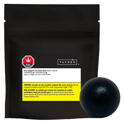 Front-facing black resealable pouch with a white label and yellow warning strip, accompanied by a round black resin ball, showing "Sour Tangerine Live Resin Hash."