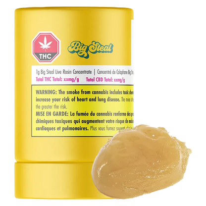 Close-up of a yellow tub labeled Big Steal Live Rosin with a glossy caramel-colored dab of concentrate in front.