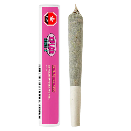 Straight-on view of a pre-roll and pink tube packaging labeled "Rainbow Razz Distillate Infused PR 1 x 1 g" against a white background.