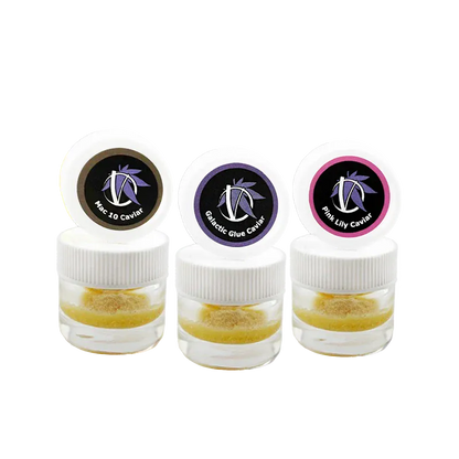 Three small clear jars photographed front-on with white lids and colored logo stickers, labeled Virtue Caviar Flight Caviar.