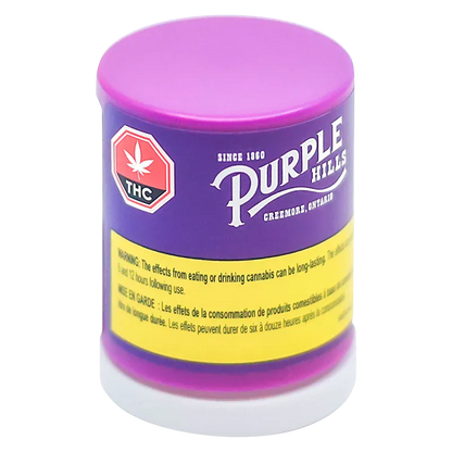 Three-quarter view of the purple and pink Tropical Twist Live Resin Badder container with a yellow warning band and THC symbol.