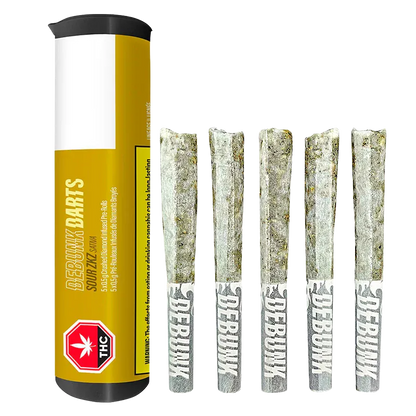 Studio-lit front view of a yellow tube beside five powdered, diamond-coated pre-rolls labeled "DEBUNK," titled Sour Zkz Bubble Hash Coated Infused PR 5 x 0.5 g