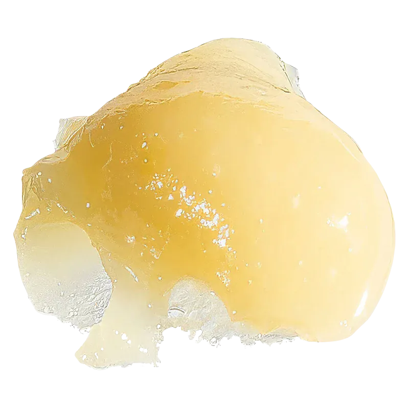 Close-up of a glossy golden dab of Gas Leak Rosin resting on a translucent, crystalline surface with bright, even lighting.
