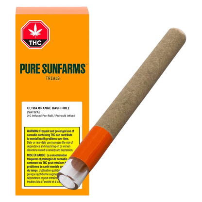 Angled view of an Ultra Orange Hash Hole Infused PR 1 x 2 g pre-roll resting beside bright orange Pure Sunfarms packaging, showing the paper tube and orange tip.