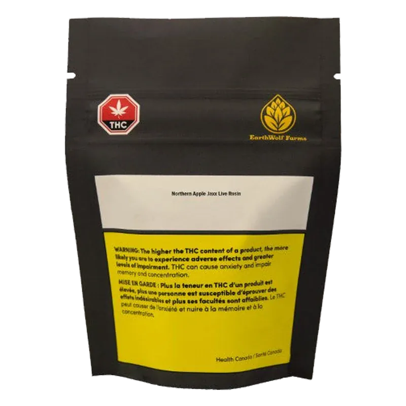 Rear view of a black pouch labeled Northern Apple Jaxx Live Rosin with a white top panel, yellow warning box, and small THC and EarthWolf Farms logos.