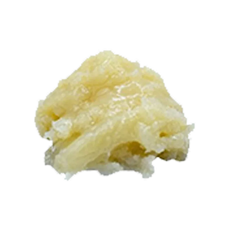 Close-up of a pale yellow crystalline nugget labeled Berry Fumez shown against a soft white background.