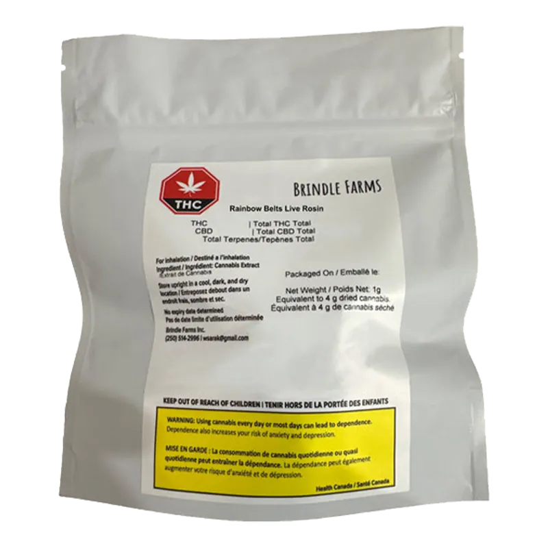 Front-facing photo of a white foil pouch labeled "Brindle Farms Rainbow Belts Live Rosin" with a red THC symbol and a yellow warning box at the bottom