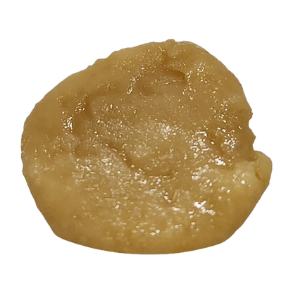Top-down close-up of a glossy, pale amber dab of 2026 Executive Blend Live Rosin showing its textured, slightly irregular surface