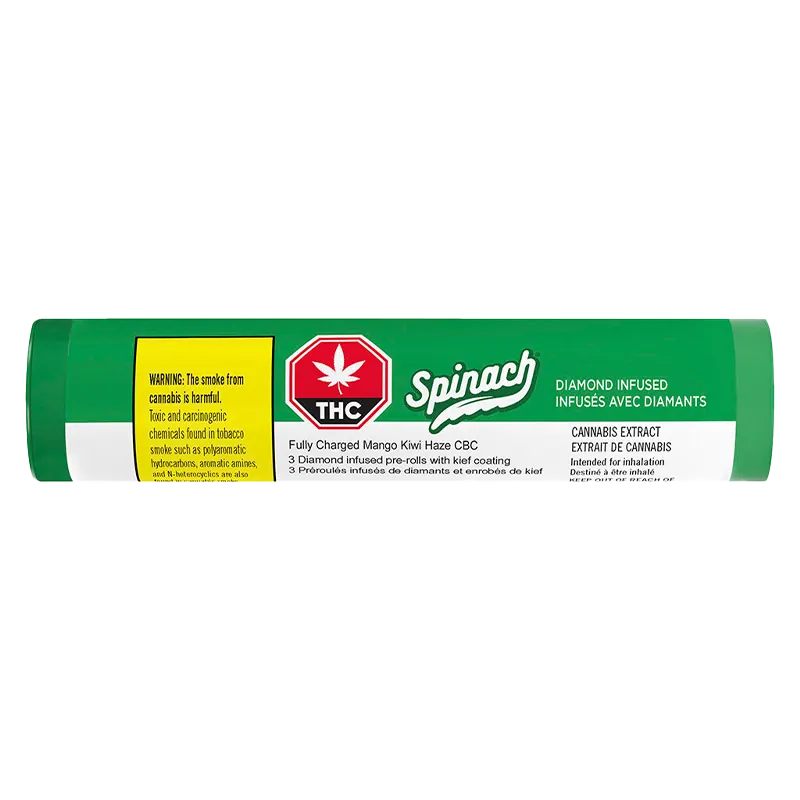 Horizontal close-up of the green tube packaging labeled "Fully Charged Mango Kiwi Haze CBC Infused PR 3 x 0.5 g" with a red THC symbol and white Spinach logo.