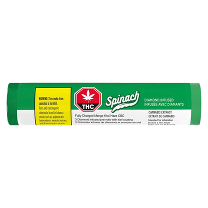 Horizontal close-up of the green tube packaging labeled "Fully Charged Mango Kiwi Haze CBC Infused PR 3 x 0.5 g" with a red THC symbol and white Spinach logo.