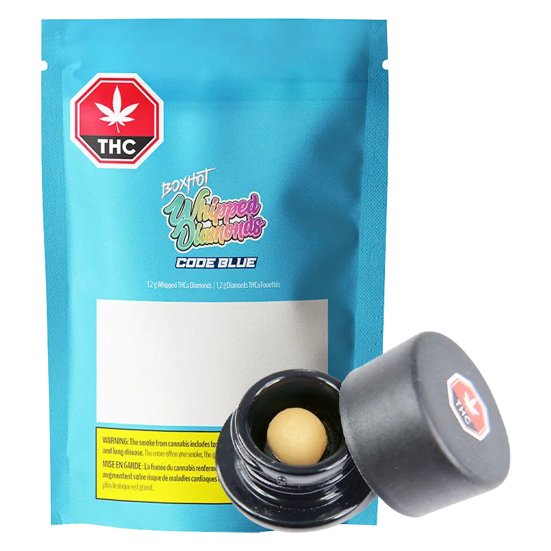 Front-facing shot of a blue pouch and open jar showing a beige ball concentrate, labeled Code Blue Whipped Diamonds.