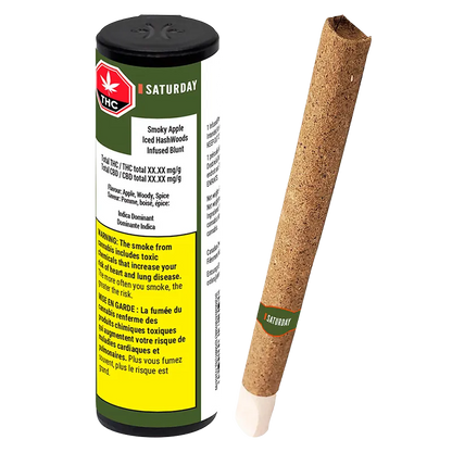 Angled view of a Smoky Apple Iced HashWoods Hash Infused PR 1 x 1 g blunt standing beside its green, white, and yellow cylindrical packaging, lit from the front.