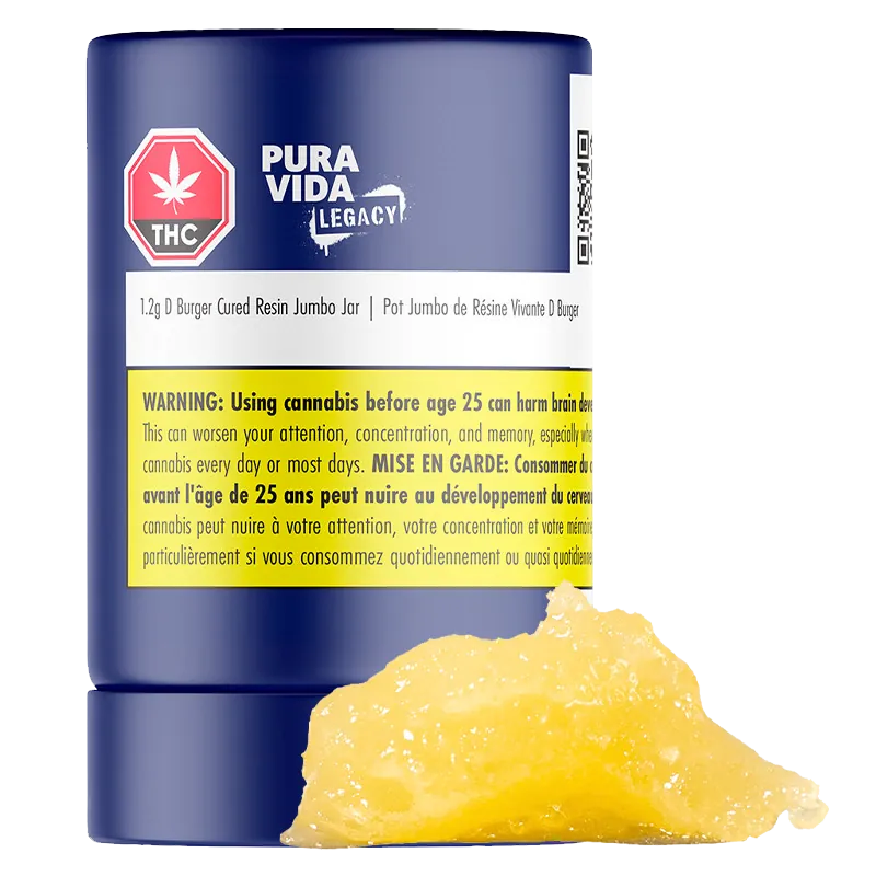 Close-up front view of a blue jar labeled "Pura Vida Legacy D Burger Cured Resin Jumbo Jar" with a yellow warning label and a dollop of golden resin in front.