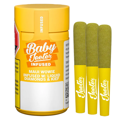 Front-facing shot of a yellow Baby Jeeter Maui Wowie Infused PR 3 x 0.5 g container beside three matching pre-rolls with green-coated tips and white "Jeeter" logos.