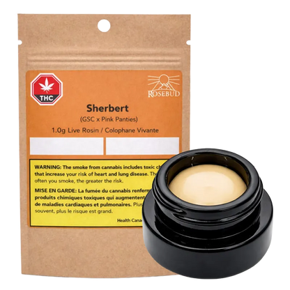 Packshot of a kraft pouch and open black jar of Rosebud Sherbert Live Rosin showing the tan, glossy concentrate and orange warning label.