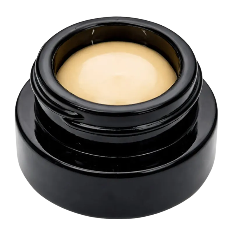 Top-down view of a glossy black jar filled with pale yellow concentrate labeled Sherbert Live Rosin.