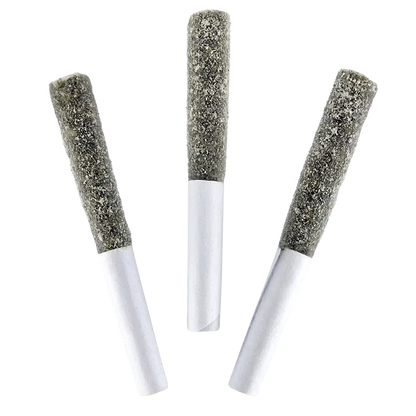 Top-down view of three Cherry Cola Infused PR 3 x 0.5 g pre-rolls with dark sugar-coated tips and white paper filters against a white background