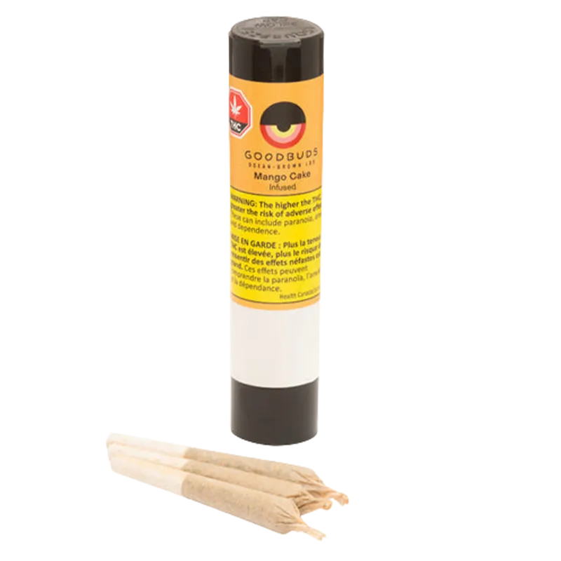 Straight-on view of a standing tube labeled "Mango Cake Hash-Infused PR 3 x 0.5 g" with three rolled joints lying in front on a white background.