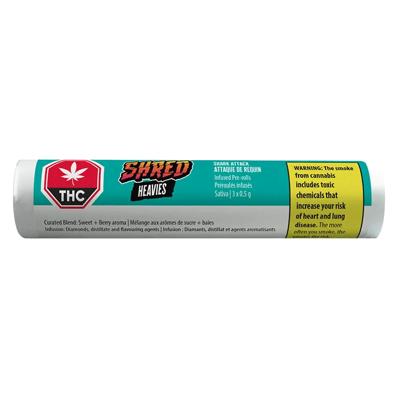 Side view of a turquoise tube labeled Shark Attack Heavies Infused PR 3 x 0.5 g with THC emblem and a yellow warning panel.