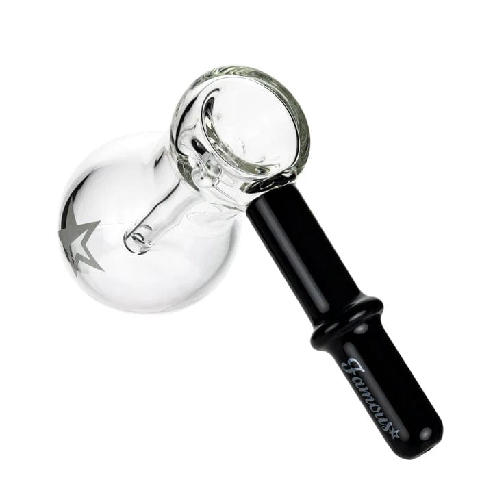 A studio shot of the 6-inch Famous X Bulb Hammer Bubbler in black, showcasing its curved form and smooth glass finish.