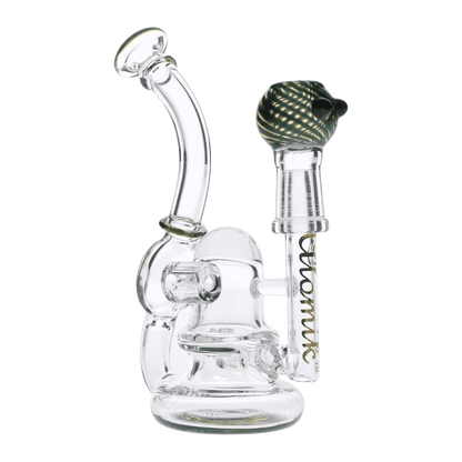 The Atomik Siena Recycler Dab Rig is displayed in a studio shot, showcasing its clear glass construction and intricate recycler design.