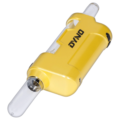 Angled close-up of the yellow Yocan Dyno Kit Yellow showing its glossy body, clear glass mouthpiece, and bold DYNO logo.
