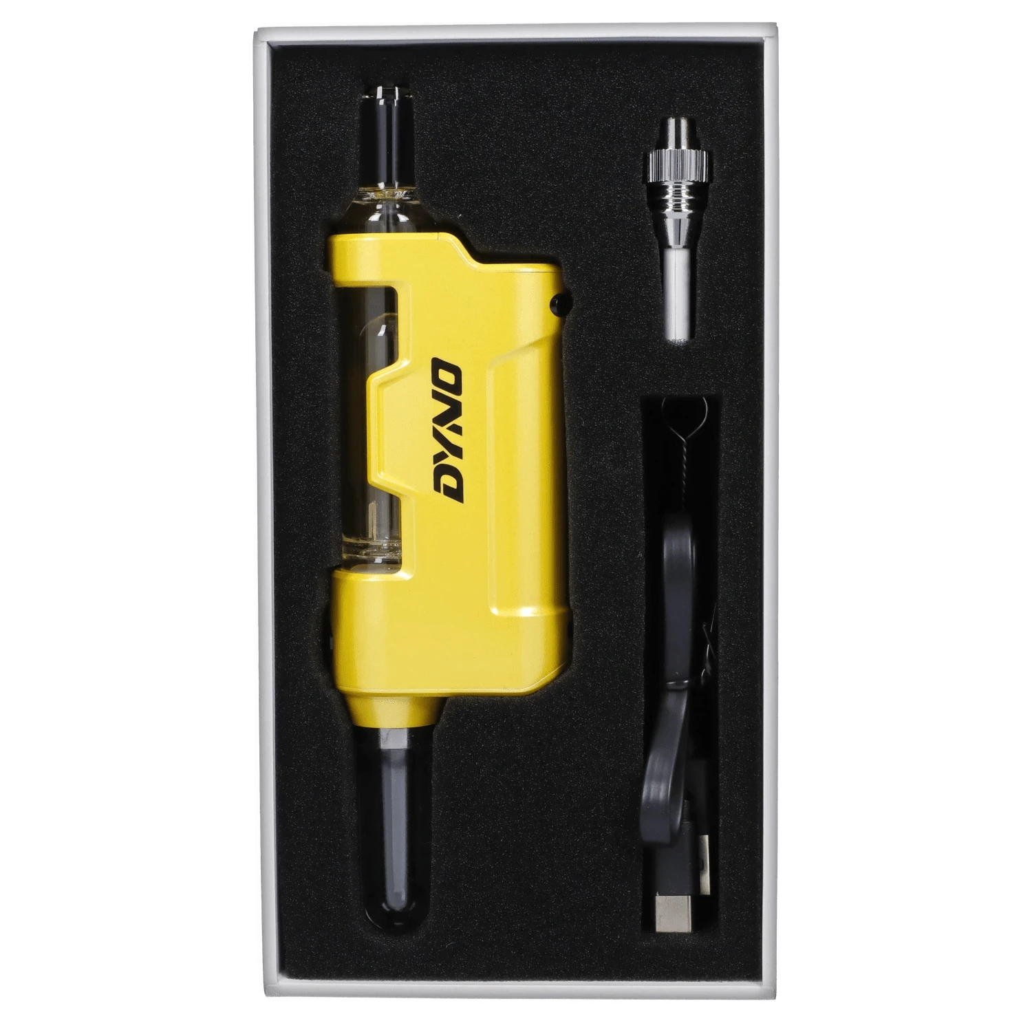 Top-down view of the yellow Yocan Dyno Kit Yellow in foam packaging with its glass mouthpiece, charger cable, and metal accessory.