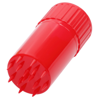 Angled close-up of a bright red Atomik Grind & Stash showing the ridged screw cap and spiked grinding teeth.
