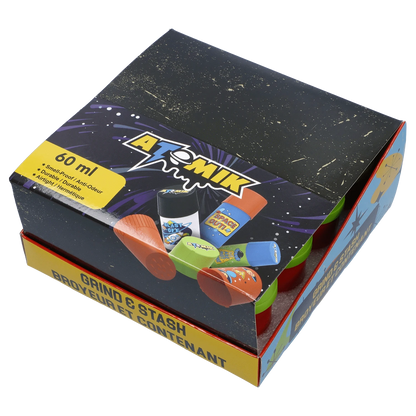 Angled top view of the colorful boxed Atomik Grind & Stash set showing playful space-themed graphics and visible red and green containers.