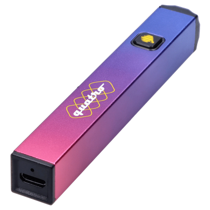 Angled close-up of a metallic gradient HoneyStick Quatro Variable Voltage Vape Multi showing its purple-to-pink finish, logo, and square power button.
