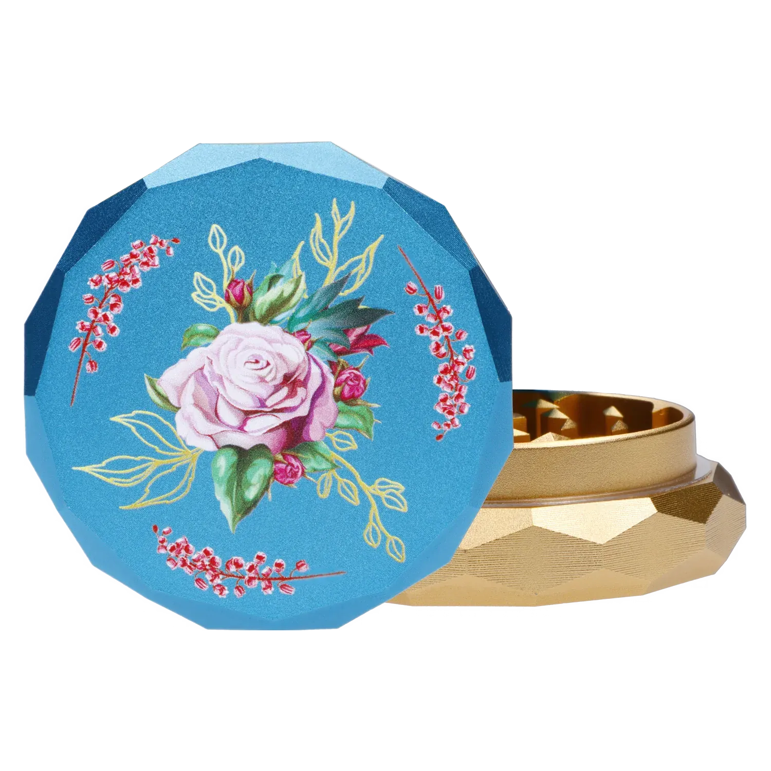 Close-up of the teal lid of the Famous Design Floral Lush Aluminum 2 Stage Grinder - Teal and Gold showing a painted pink rose and gold-accented facets beside the gold lower chamber