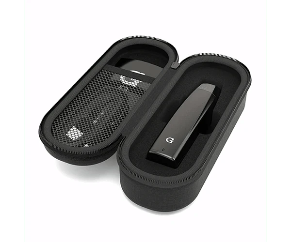 The G Pen Elite Dry Herb Vaporizer is shown open, revealing its interior within a black carrying case.
