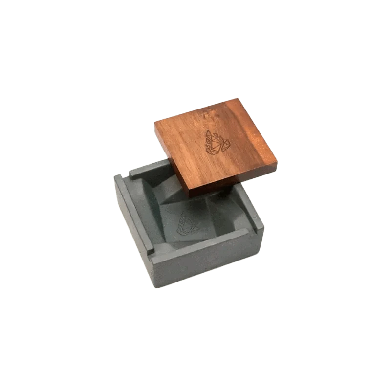 A top-down view of the BRN Briq Concrete Ashtray (Marble), showcasing its square shape and textured, stone-like surface.