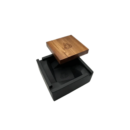 A top-down view of the BRN Briq Concrete Ashtray (Marble) with a simple, modern design and a dark interior.