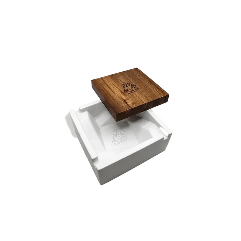 A top-down view of the BRN Briq Concrete Ashtray (Marble) on a white surface, showcasing its square shape and textured finish.