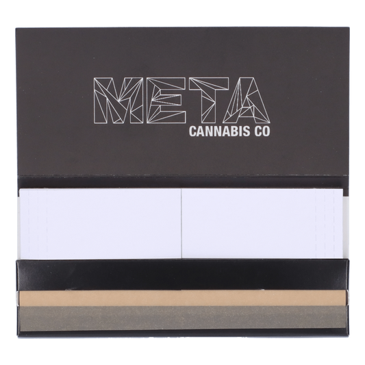 Unbleached Rolling Papers with Crutches - King Size are pictured from a slightly above angle, showcasing the neatly stacked papers within their packaging.