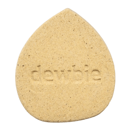 A close-up shot of the Devil's Lettuce Dewbie Rehydrating Stone, displaying its textured, light-brown surface.