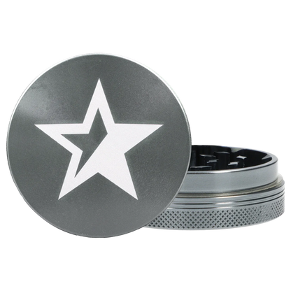 Close-up front view of the Famous X Chrome 2 pc Grinder - Gray-55mm showing its gray lid with a white star and the textured metal base partially open.